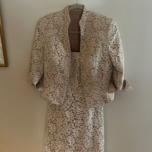 Blush lace dress with jacket .